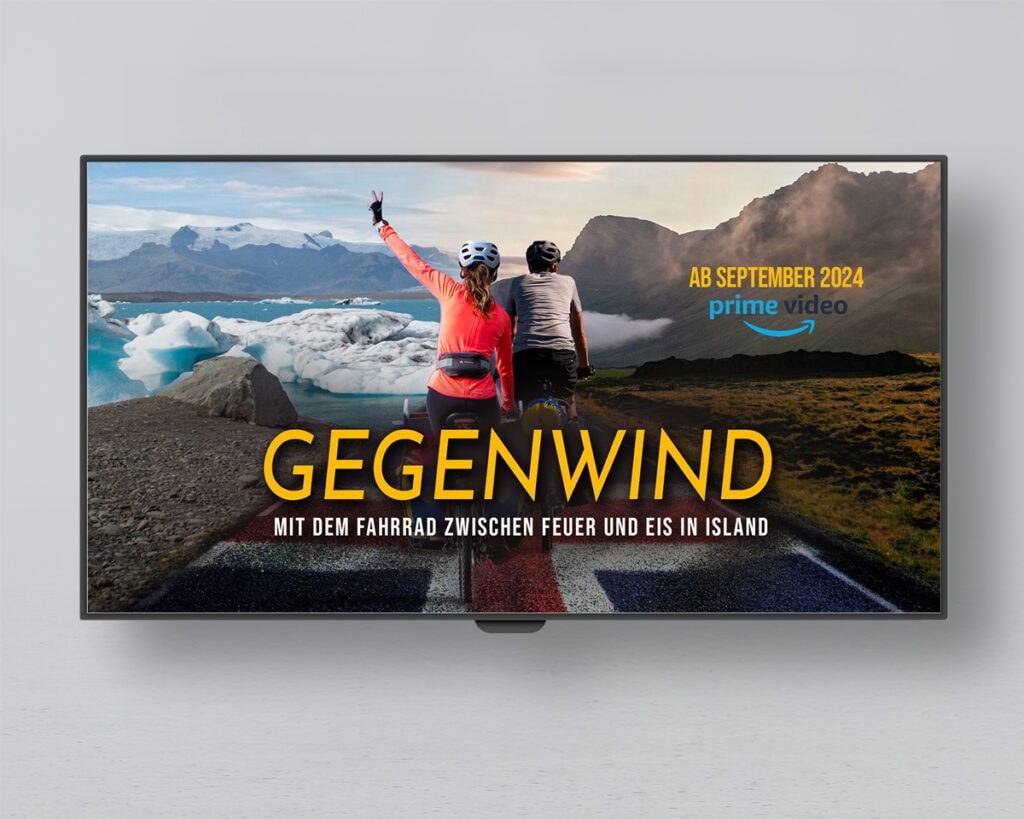 Flatscreen an einer Wand mit Filmplakat der Gegenwind Doku